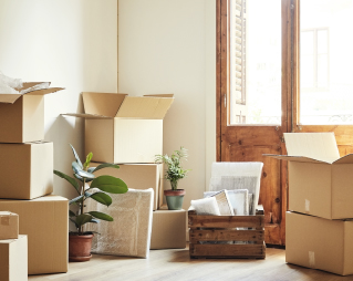 Image of moving boxes in the inside entry of a home.